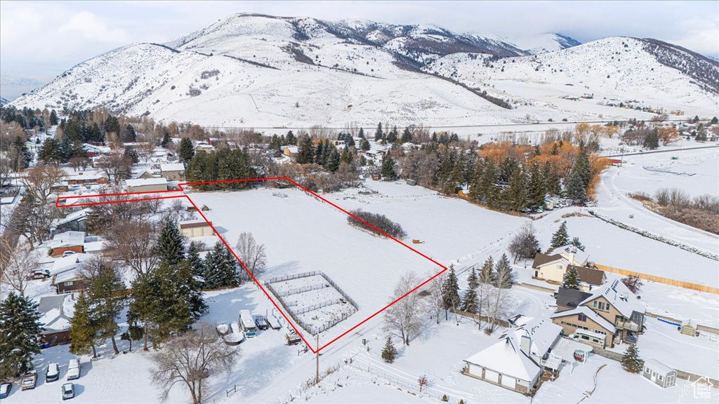 Snowy aerial view with a mountain view