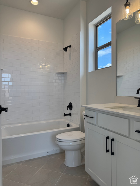 Full bathroom featuring tile patterned floors, vanity, tub / shower combination, and toilet