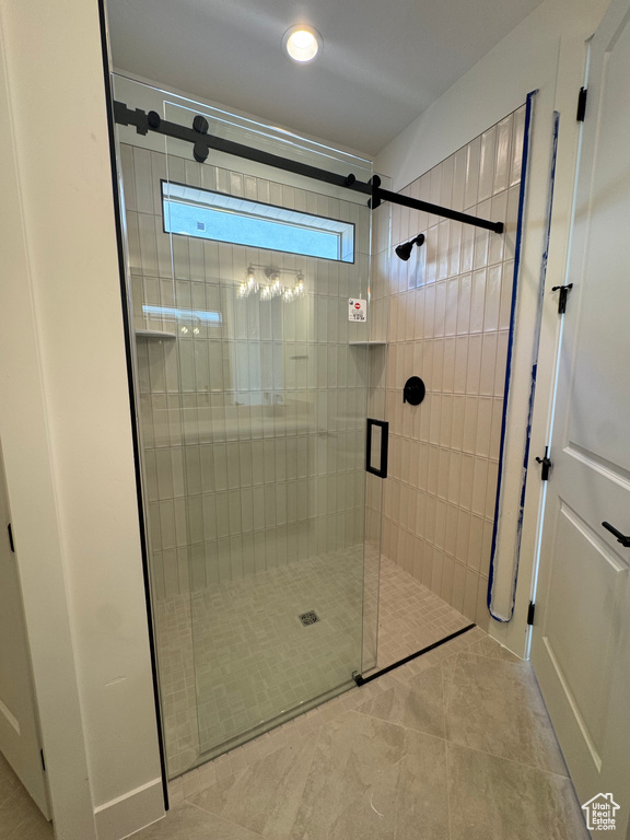 Full bathroom featuring a stall shower and tile patterned floors