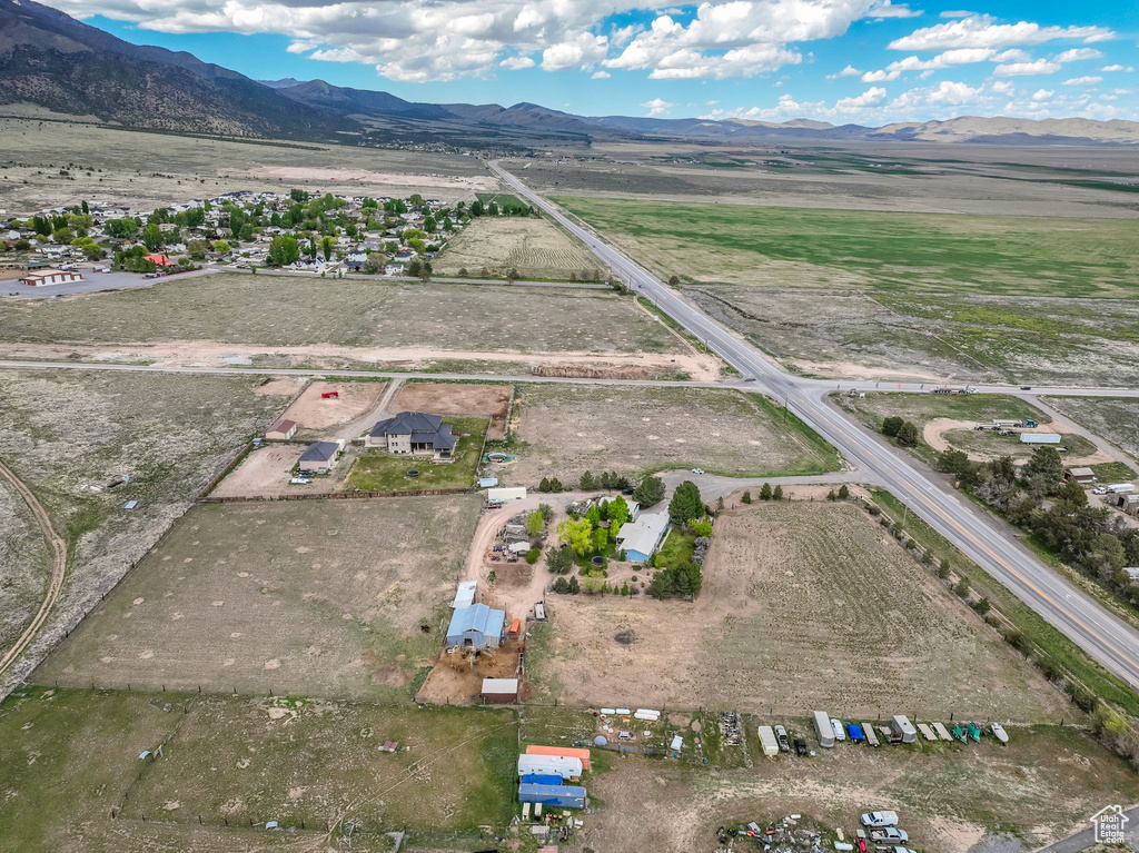 Overview of rural landscape featuring a mountain backdrop
