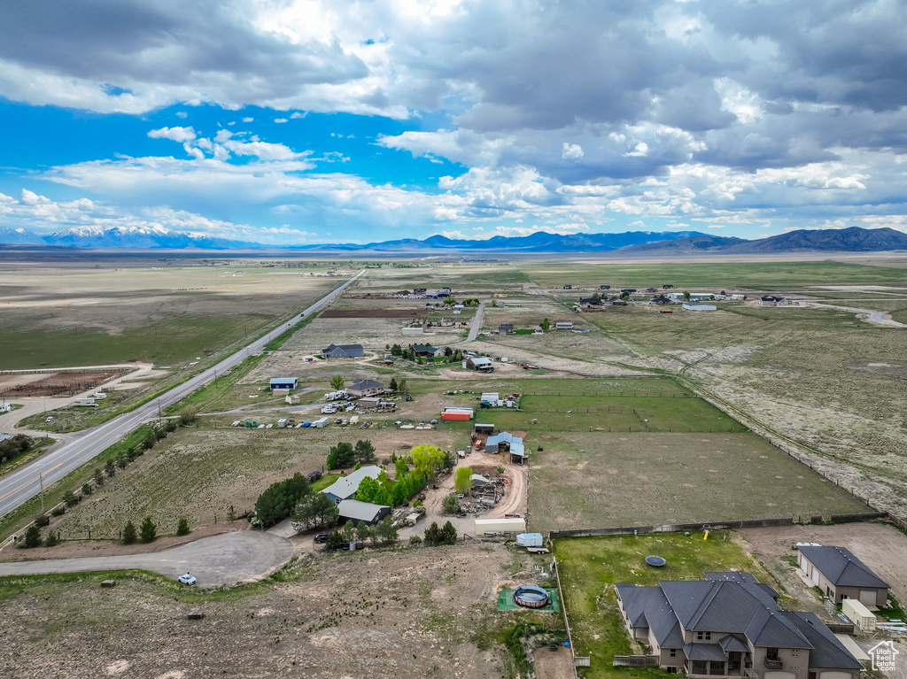 Aerial view of sparsely populated area featuring a mountainous background