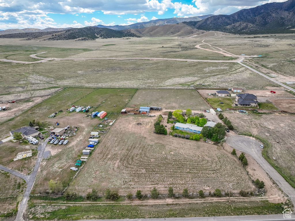 Aerial view of sparsely populated area featuring a mountain backdrop
