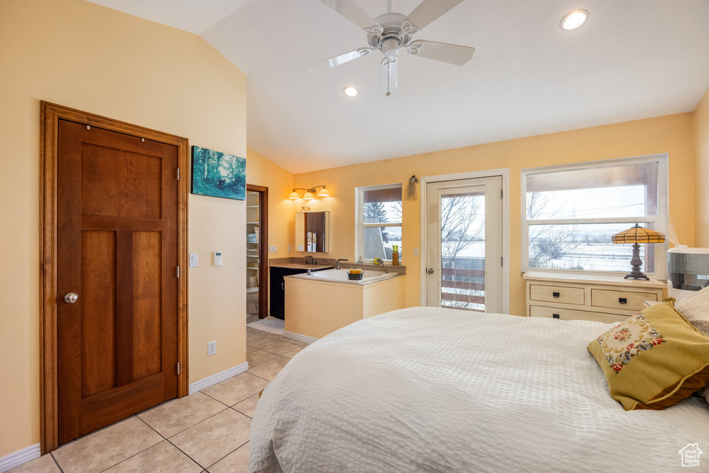 Bedroom with access to exterior, lofted ceiling, light tile patterned floors, recessed lighting, and ceiling fan
