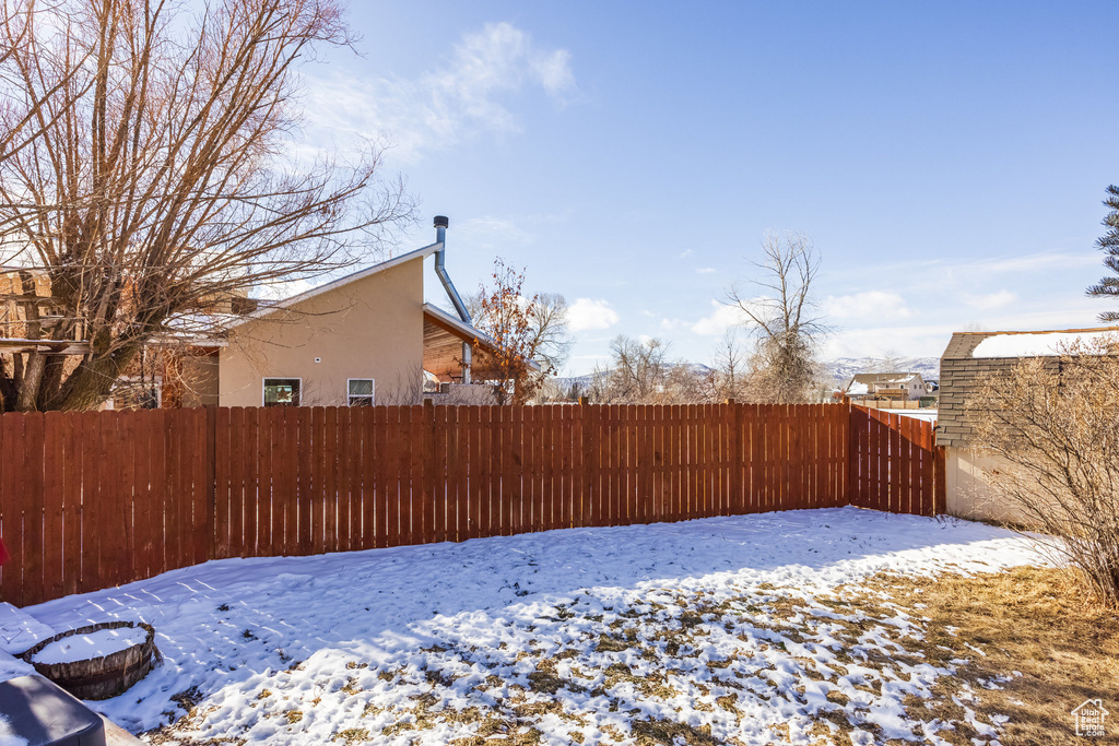View of yard layered in snow