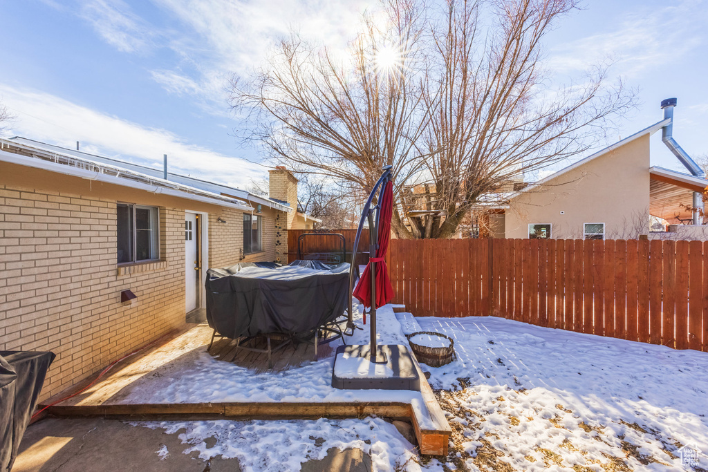 View of yard covered in snow