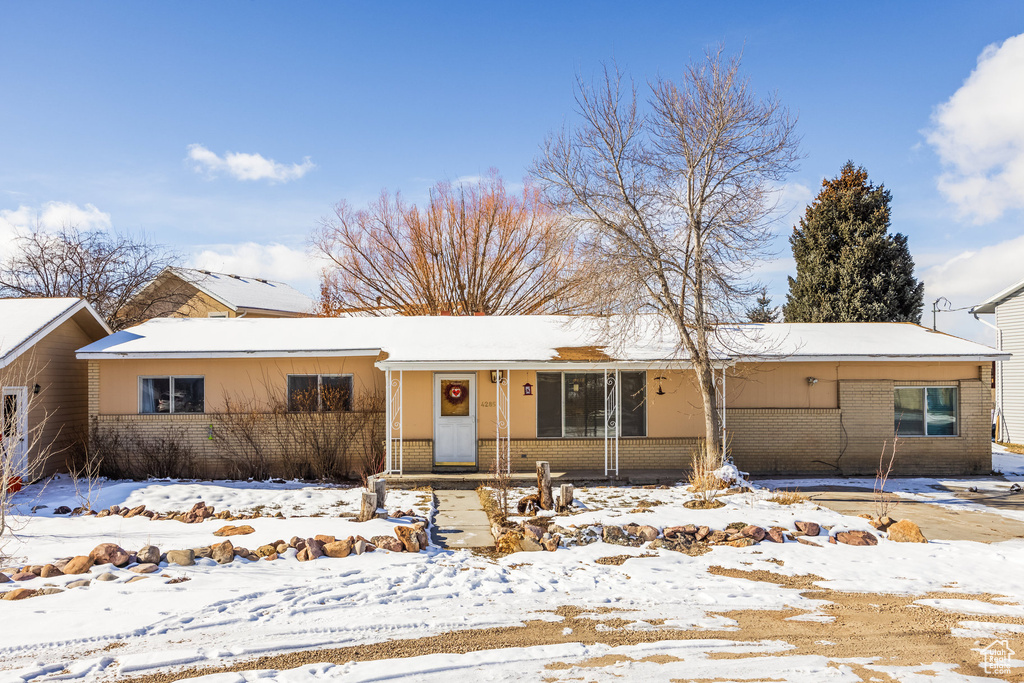 Ranch-style house featuring brick siding