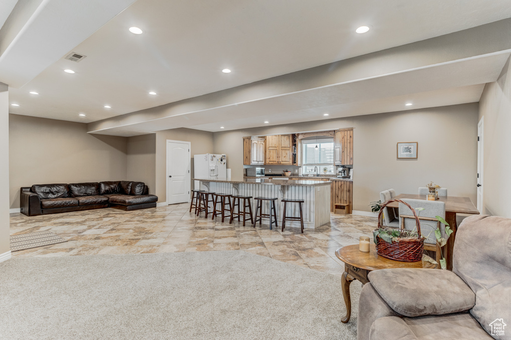 Living room featuring recessed lighting and light colored carpet