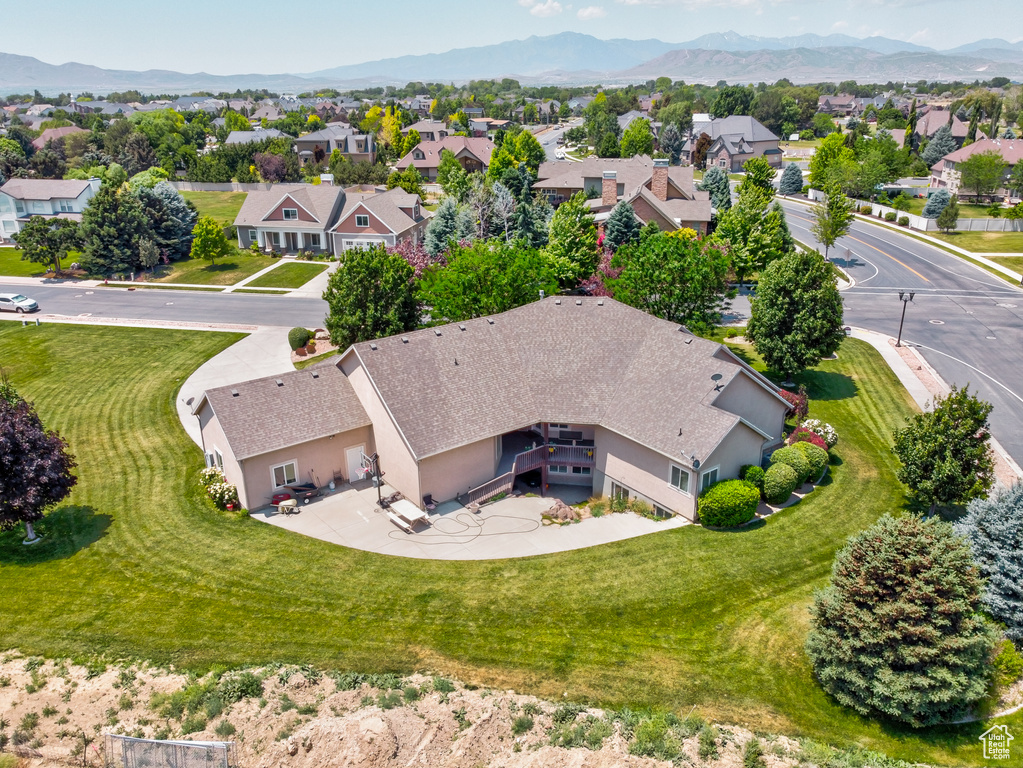 Aerial perspective of suburban area featuring a mountain backdrop