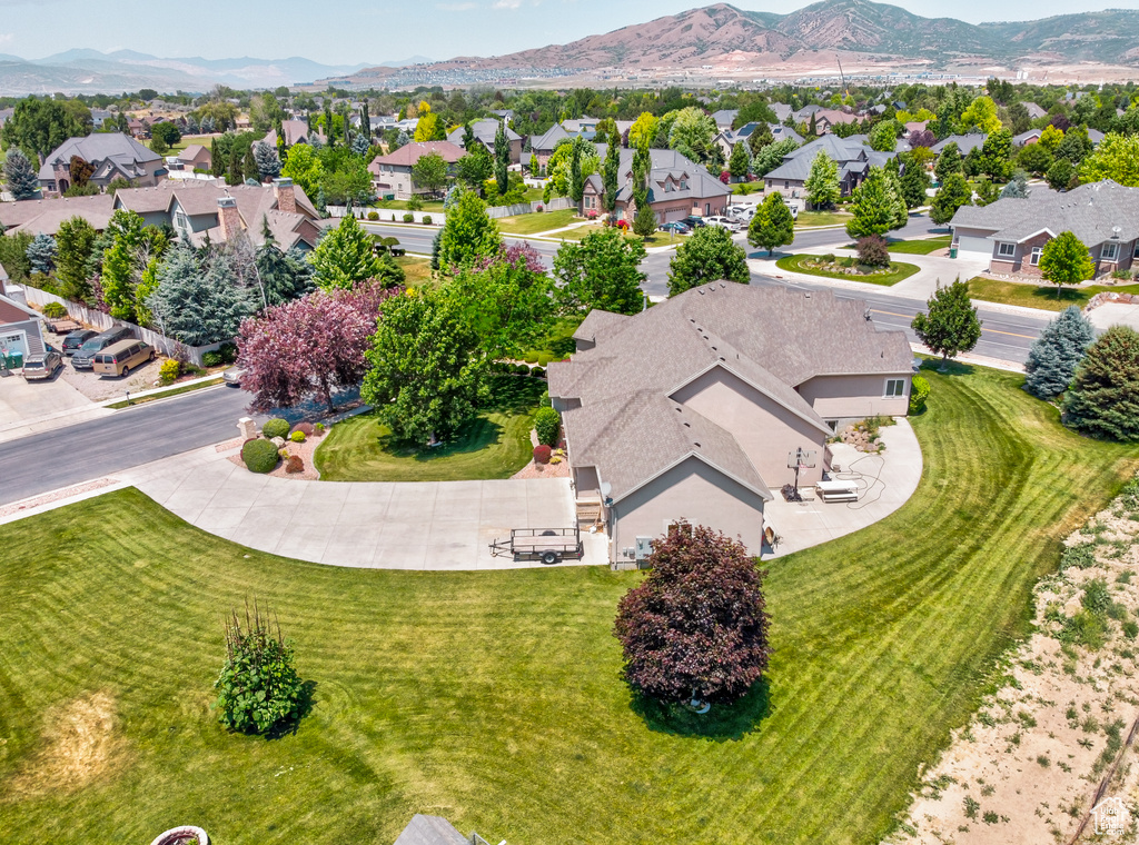 Aerial view of residential area featuring a mountainous background