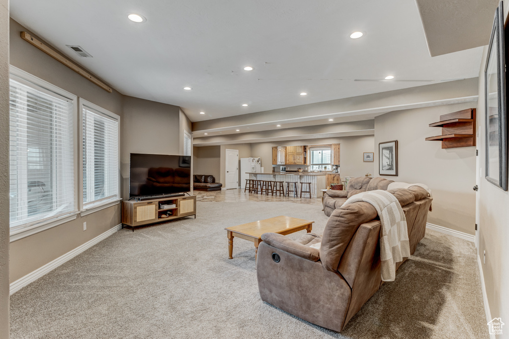 Living room featuring light carpet and recessed lighting