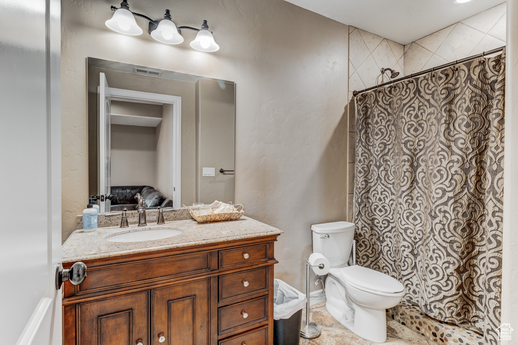 Bathroom featuring vanity and a shower with curtain
