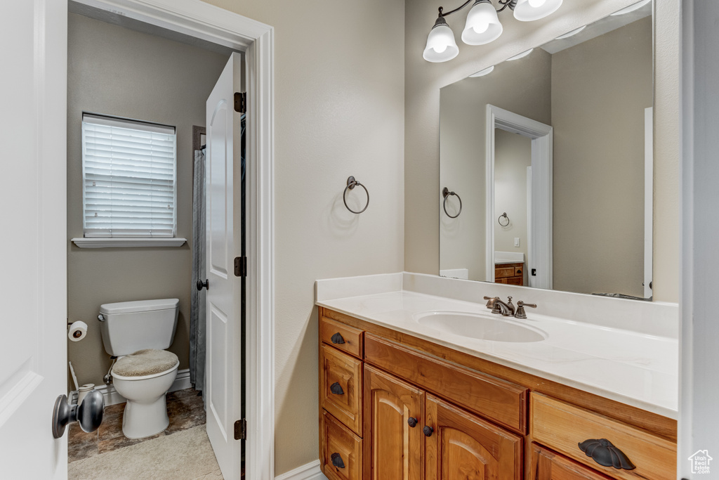Bathroom featuring toilet and vanity