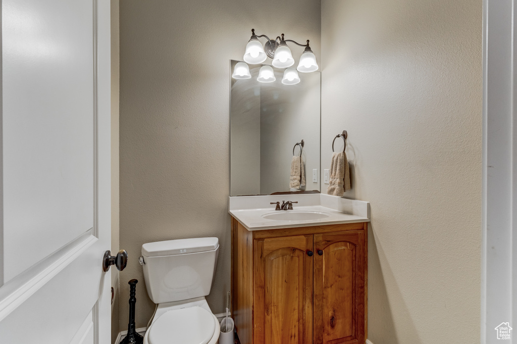 Half bath with vanity and toilet