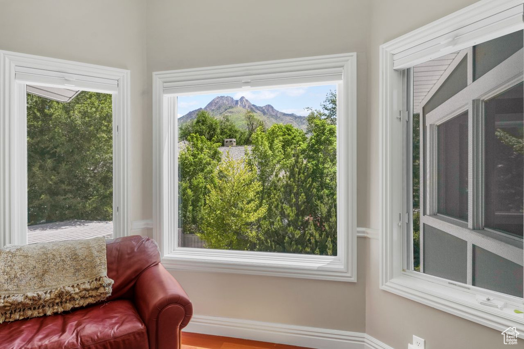 Sunroom featuring a mountain view