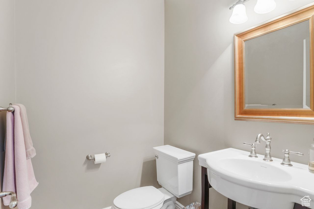 Bathroom featuring sink and toilet