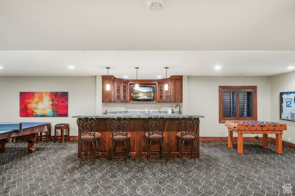 Bar with pendant lighting and sink