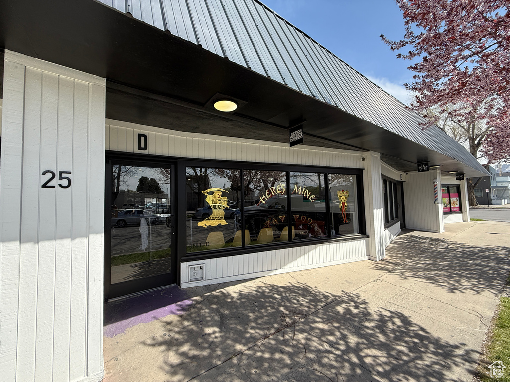 View of exterior entry featuring metal roof