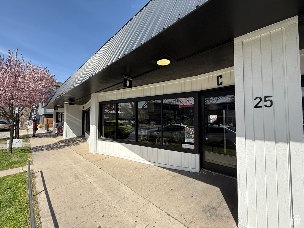 View of exterior entry featuring metal roof