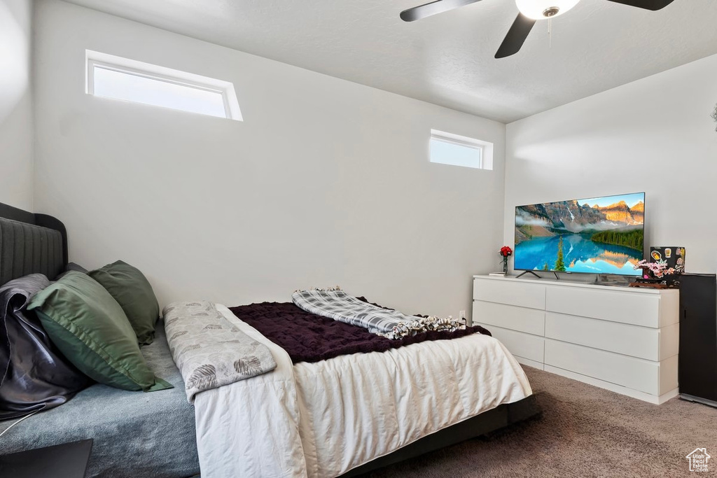 Bedroom with carpet flooring and ceiling fan