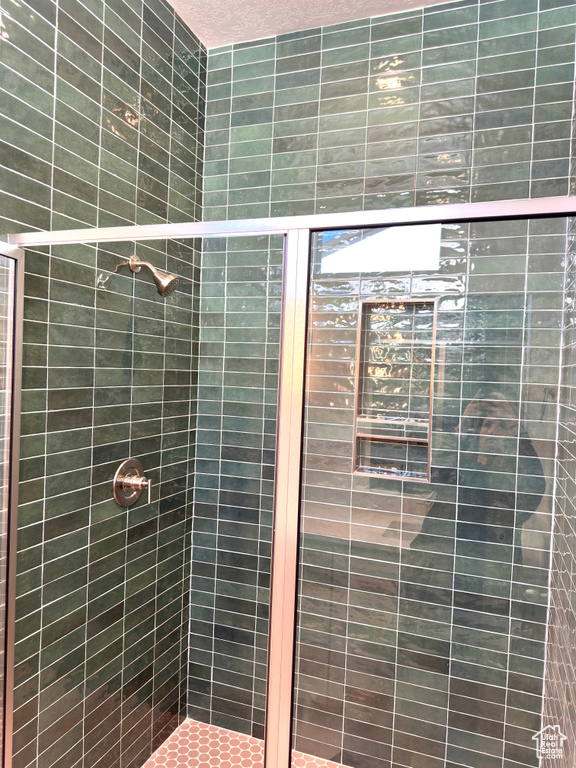 Full bathroom featuring a stall shower