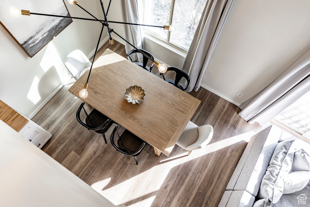 Dining space featuring baseboards and wood finished floors