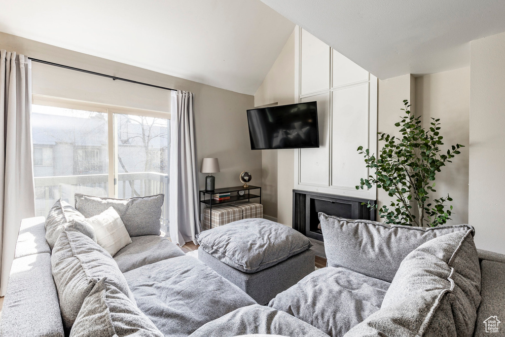 Living area featuring vaulted ceiling