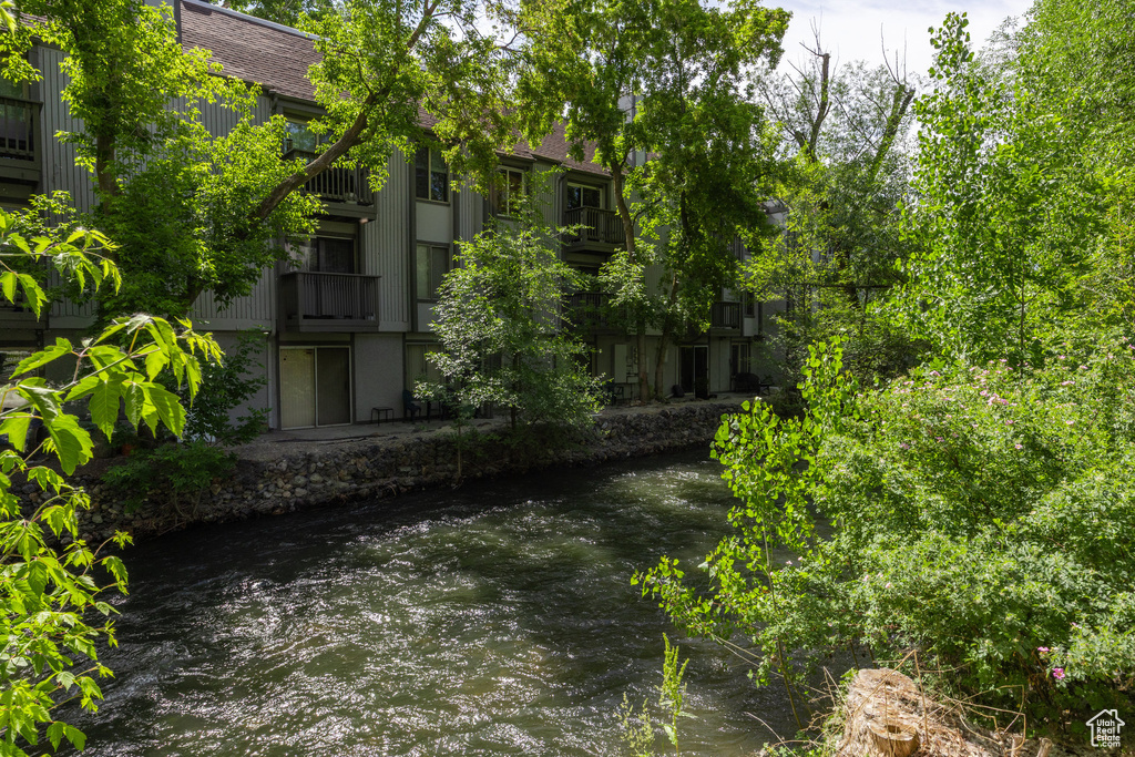 View of yard with a water view