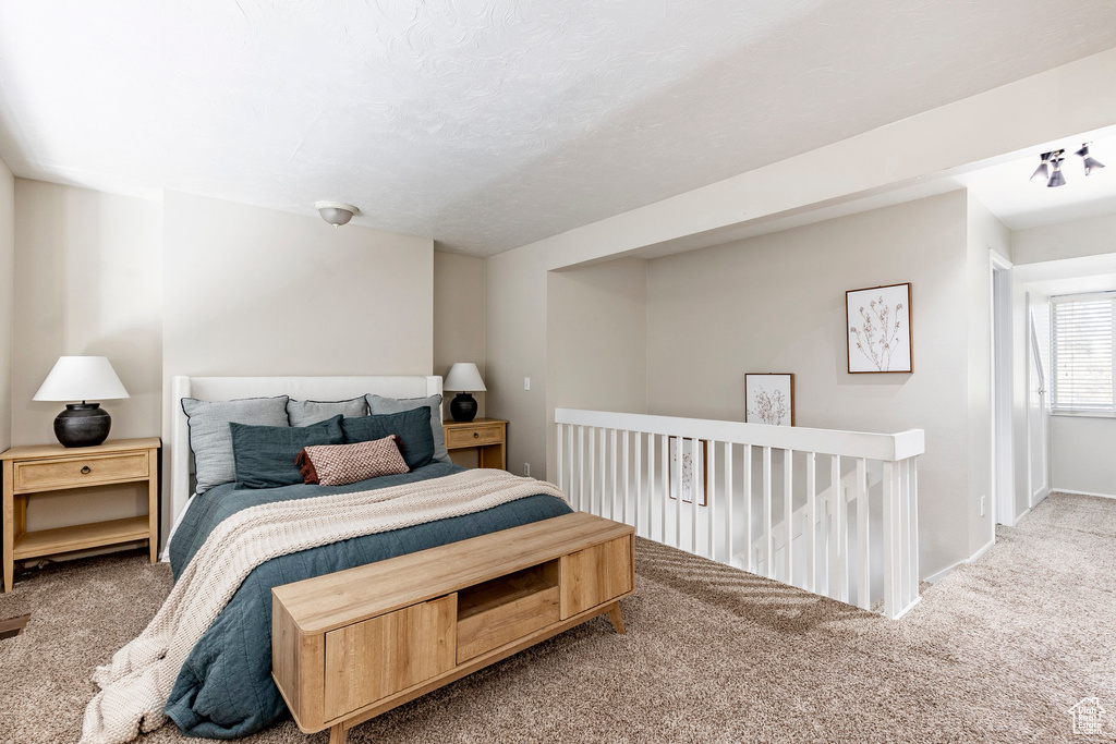 Carpeted bedroom with baseboards