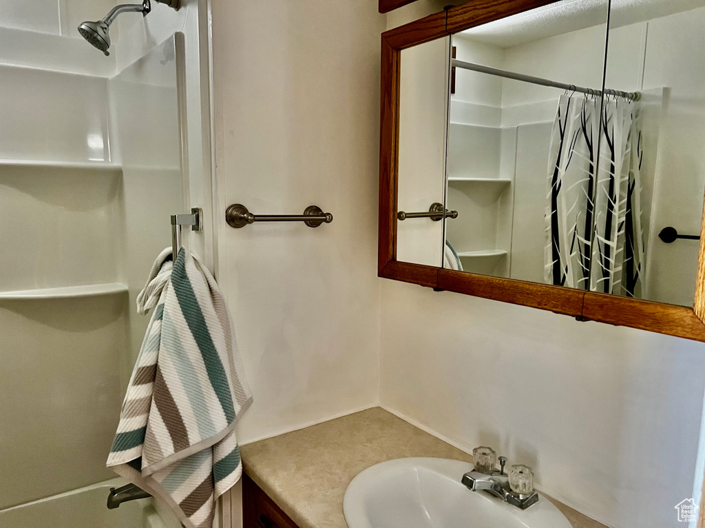 Bathroom with vanity and a shower with curtain