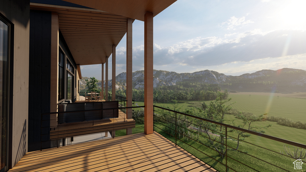 Balcony featuring a mountain view and a rural view