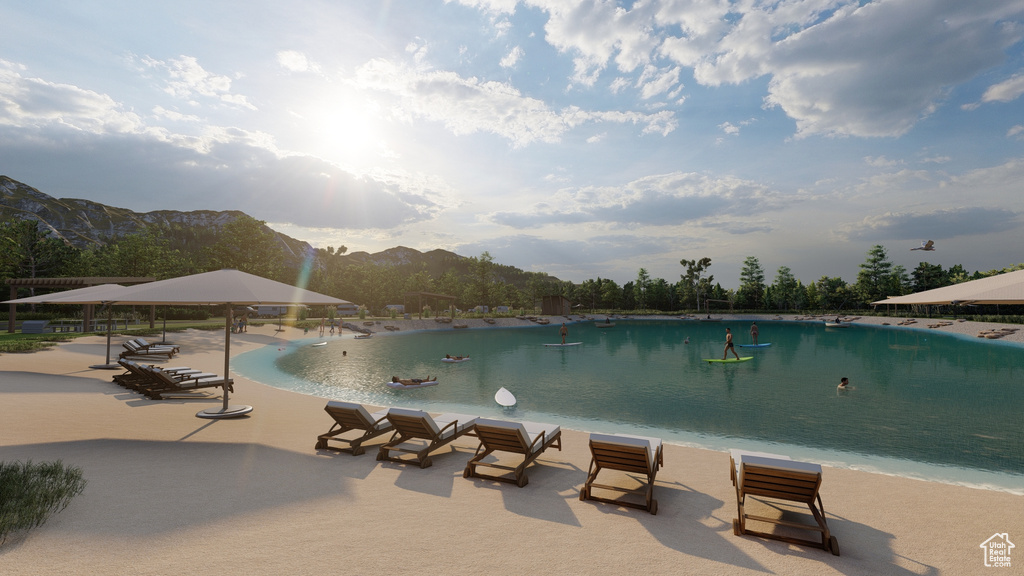 View of pool featuring a patio and a water and mountain view