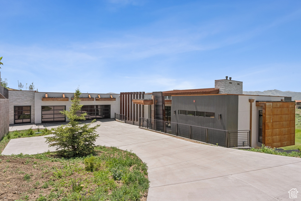 View of building exterior featuring driveway