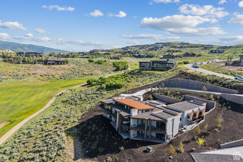Aerial view of mountains and a golf club