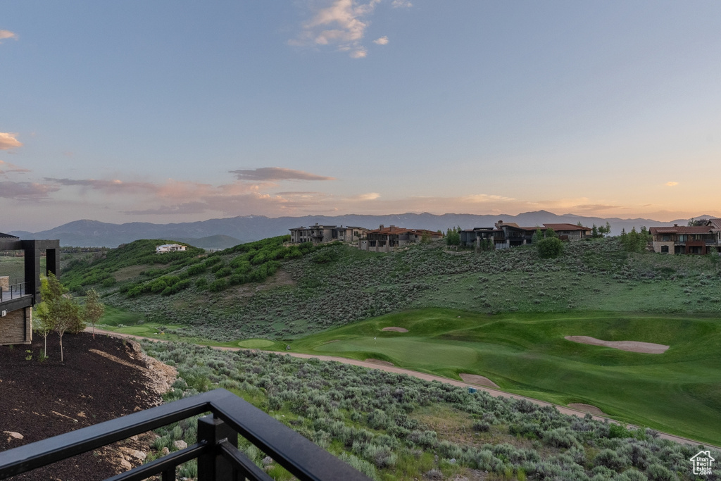 View of mountain backdrop with a golf course