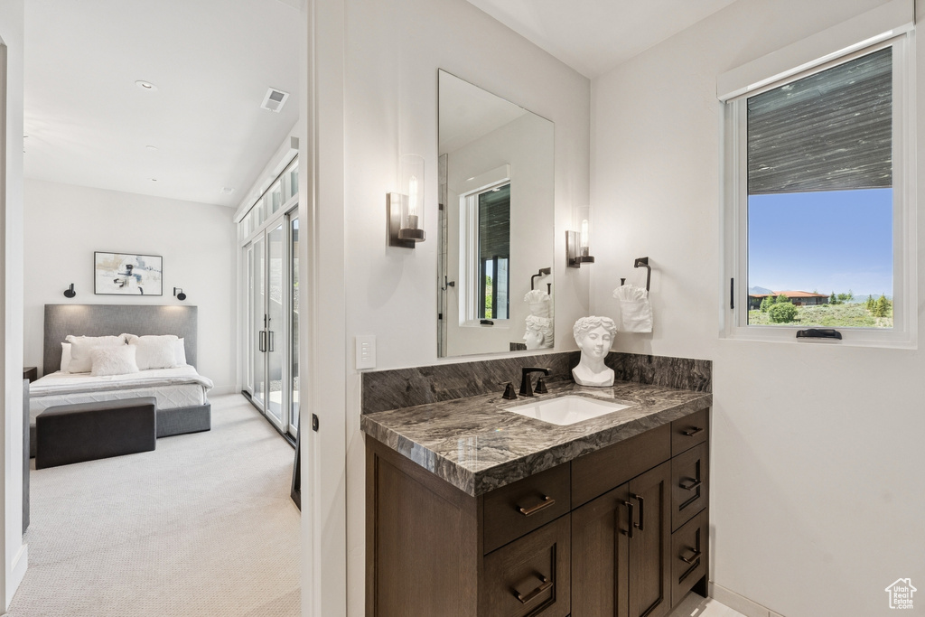 Ensuite bathroom with vanity and plenty of natural light