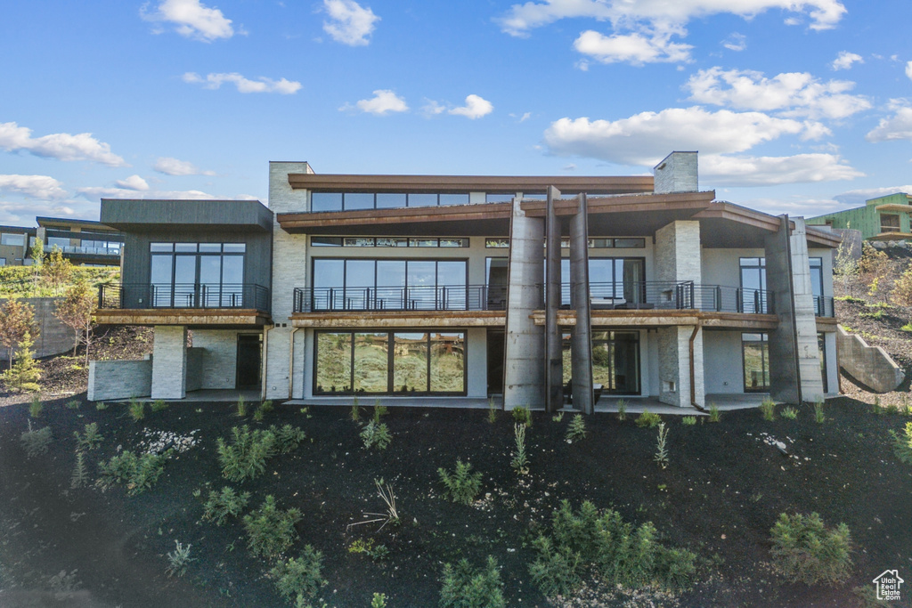 Rear view of house featuring a balcony