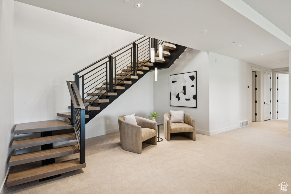 Staircase featuring carpet floors and recessed lighting