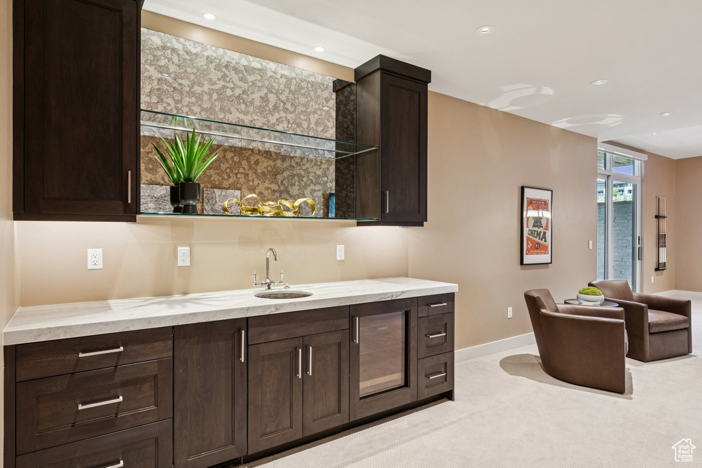 Indoor wet bar featuring recessed lighting and baseboards