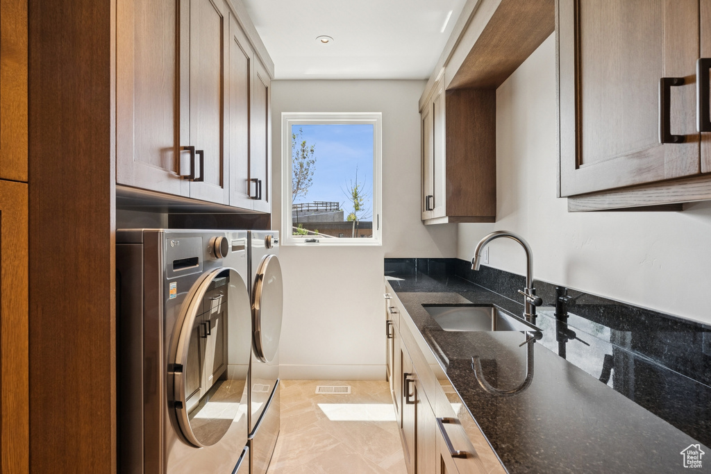 Washroom with separate washer and dryer and cabinet space