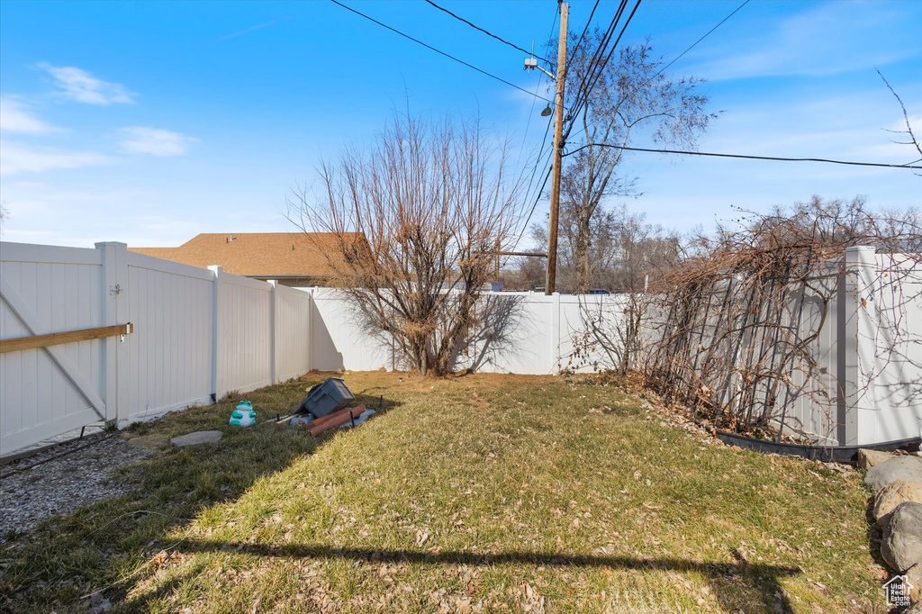View of yard featuring a fenced backyard