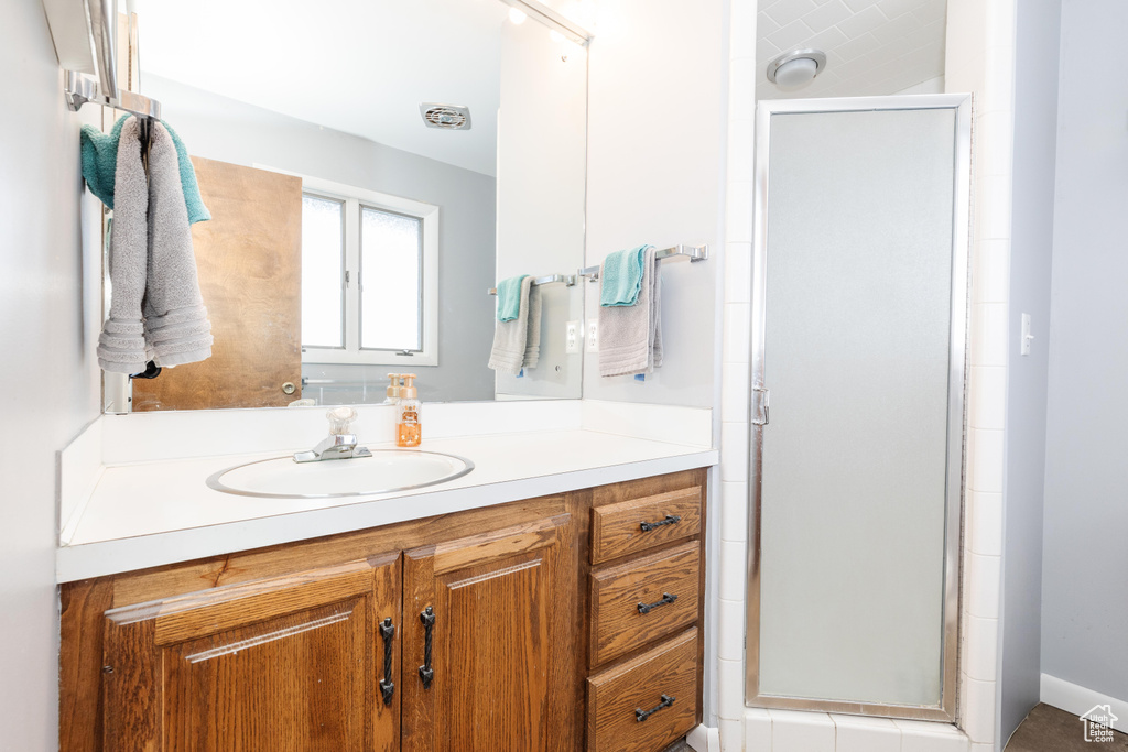 Bathroom with vanity and walk in shower