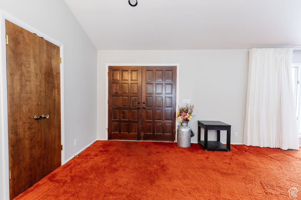 View of carpeted entrance foyer