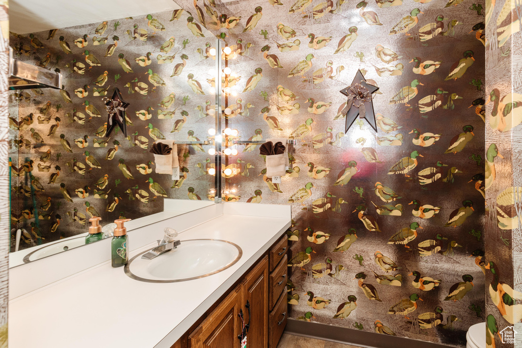 Bathroom with vanity and toilet