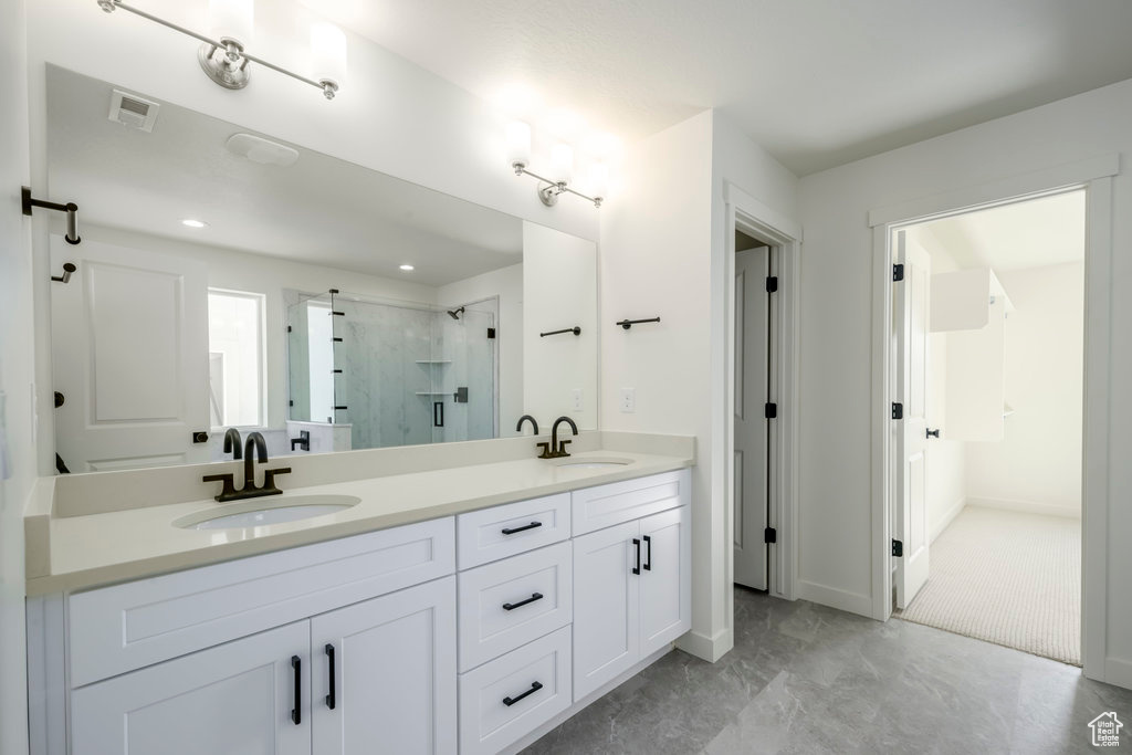 Bathroom with vanity and an enclosed shower
