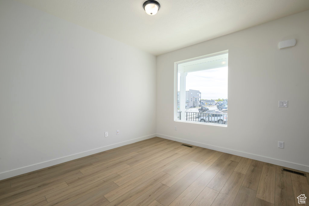 Empty room featuring light hardwood / wood-style floors