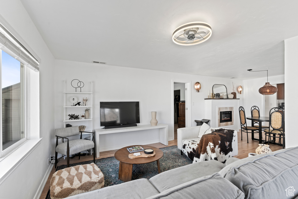 Living room with light wood-type flooring