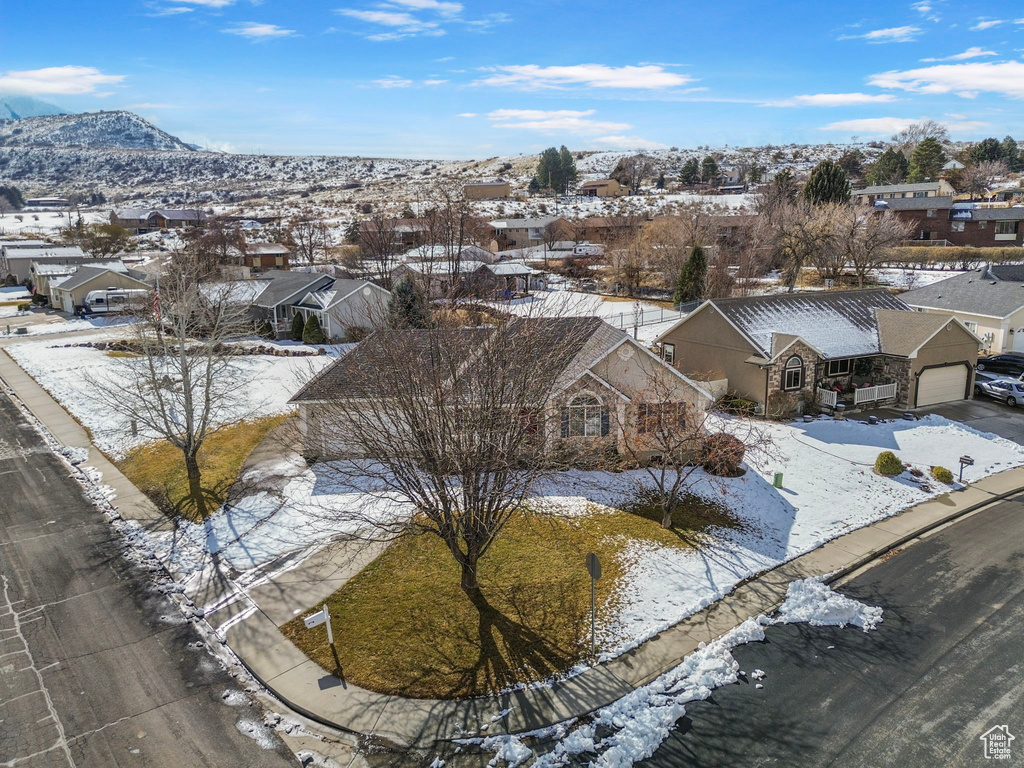 Snowy aerial view featuring a mountain view