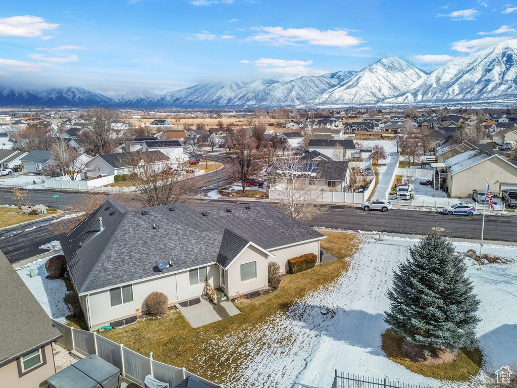 Snowy aerial view featuring a mountain view