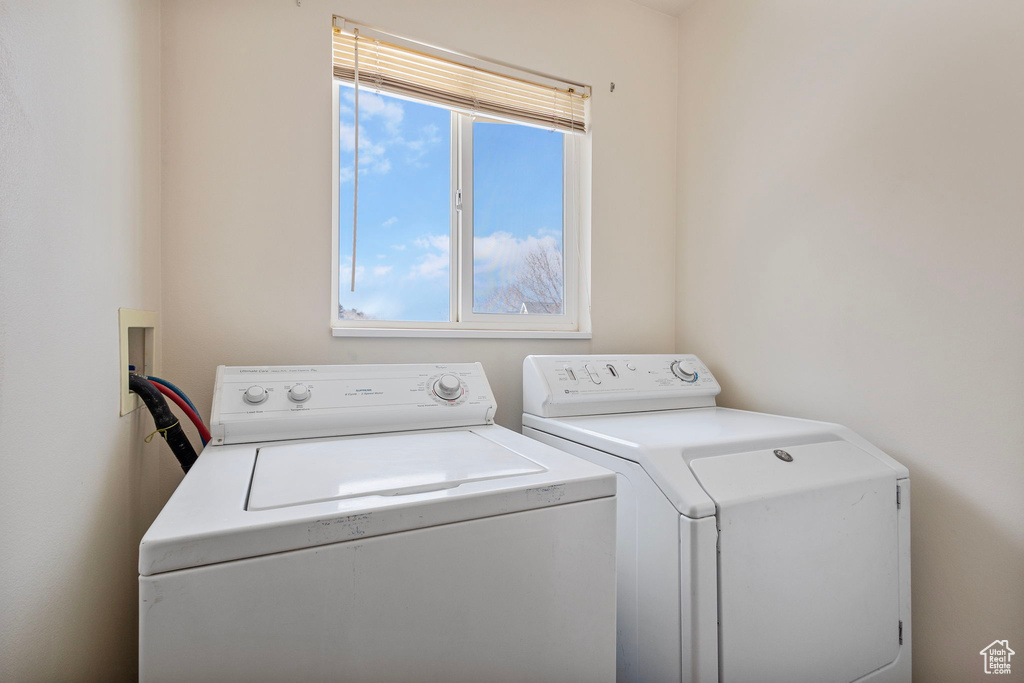 Washroom featuring washing machine and clothes dryer