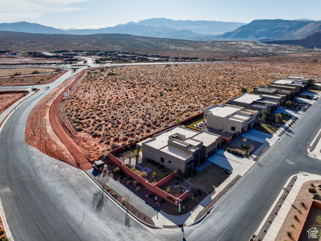 Birds eye view of property with a mountain view